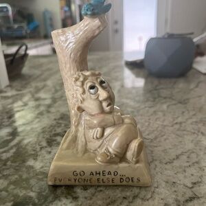 Whimsical Cream Figurine with Blue Bird